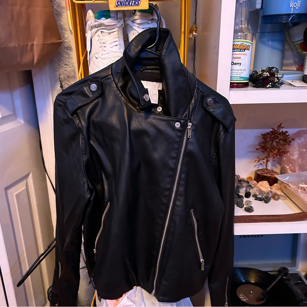 Women’s black, cropped, leather jacket.